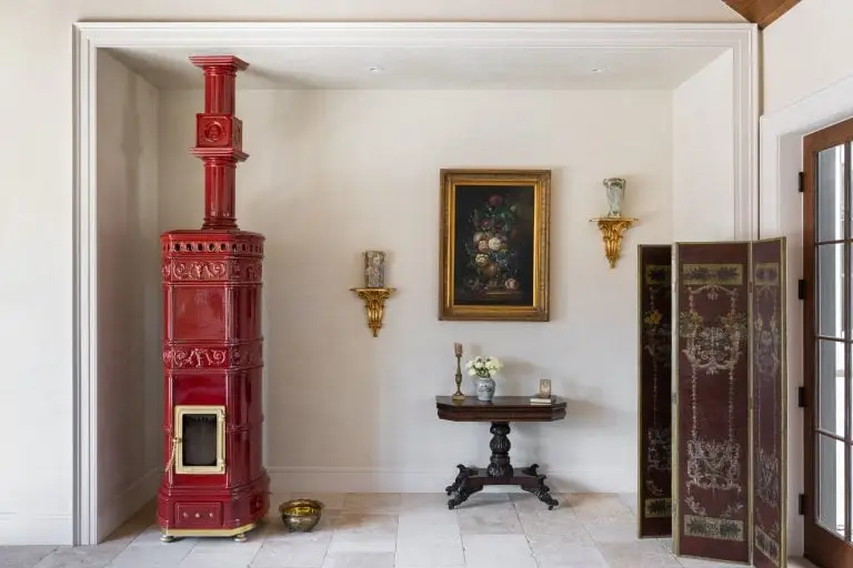 Stylish interior featuring a red vintage fireplace and classic decor.